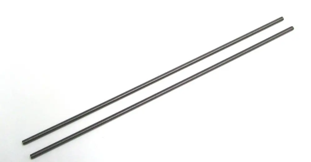 Zwei lange, metallische Stangen in dunkler Farbe, die gleichmäßig und gerade sind, möglicherweise für den Einsatz in Heizungsanlagen von Daikin.